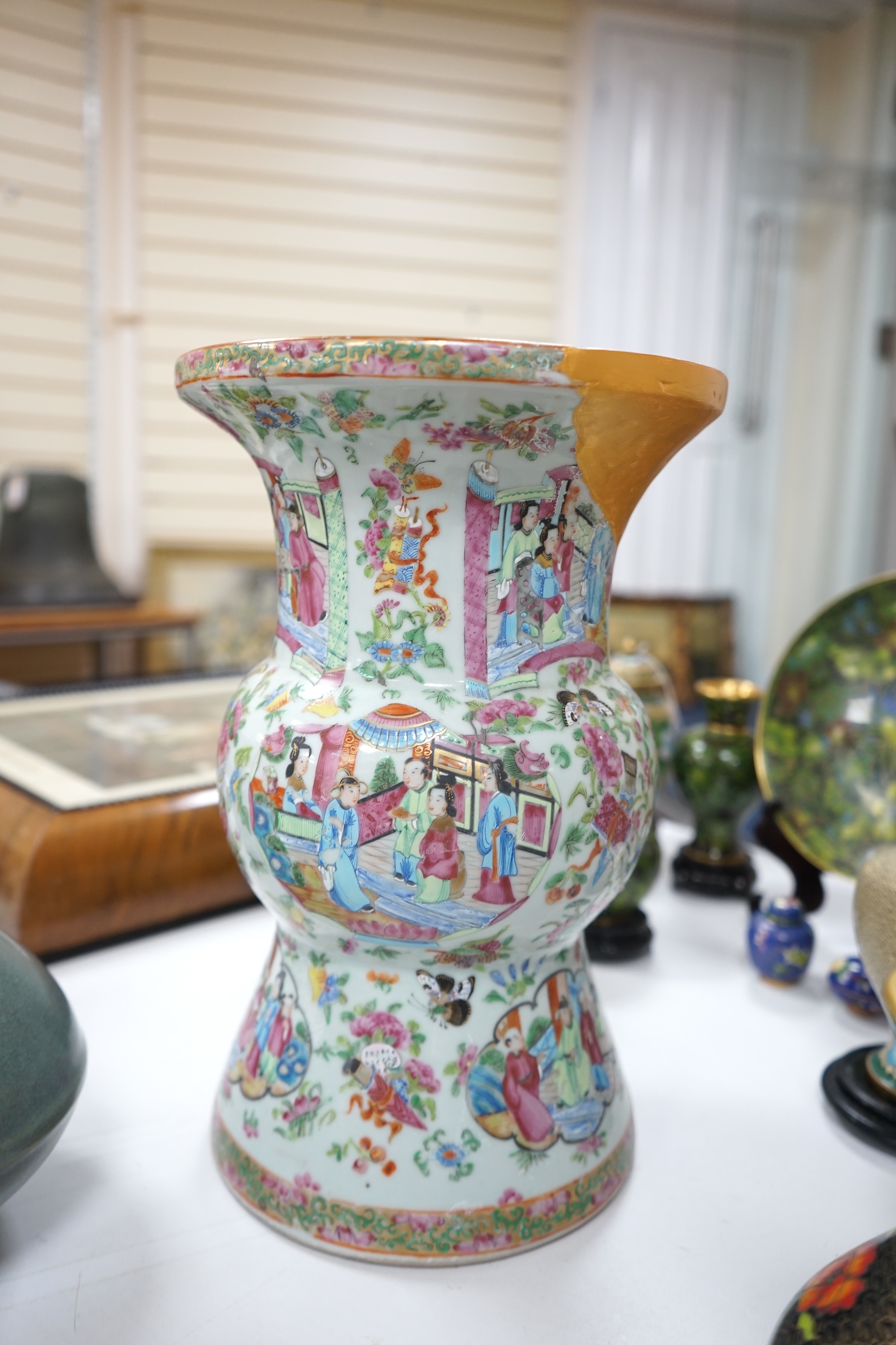 A large 19th century Chinese famille rose vase, a green glazed pear-shaped vase, and a blue and white dragon flask (3). Condition - poor to fair.